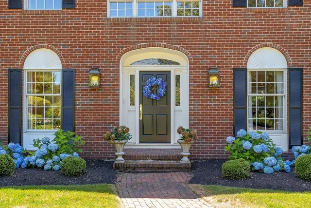 a front view of a house having yard