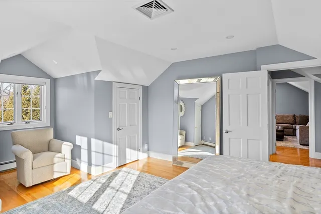 a bedroom with a bed and couch