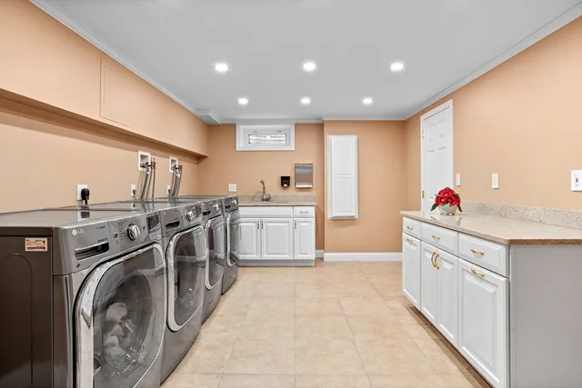 a open kitchen with stainless steel appliances granite countertop a sink stove and cabinets