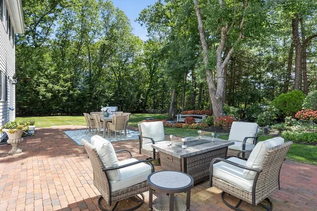 a view of a sitting area with furniture in backyard