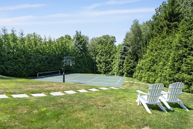 a view of a backyard with swimming pool