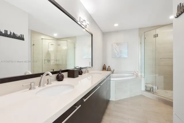 a bathroom with a tub and shower