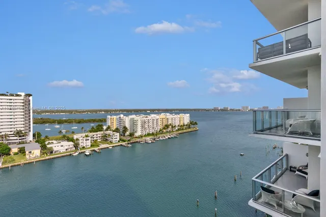a living room with furniture potted plant and a fireplace