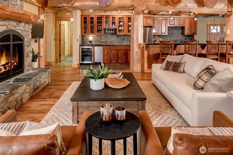 a view of a living room and kitchen with furniture