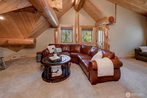 a living room with furniture a window and gym