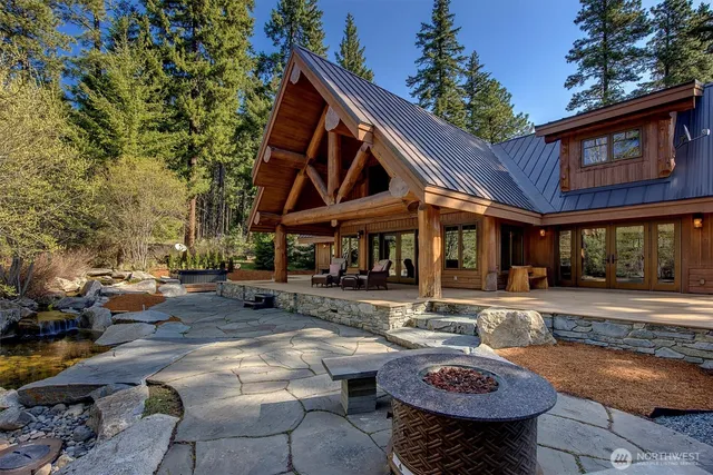 a front view of a house with sitting area