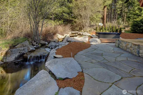 a backyard of a house with outdoor seating