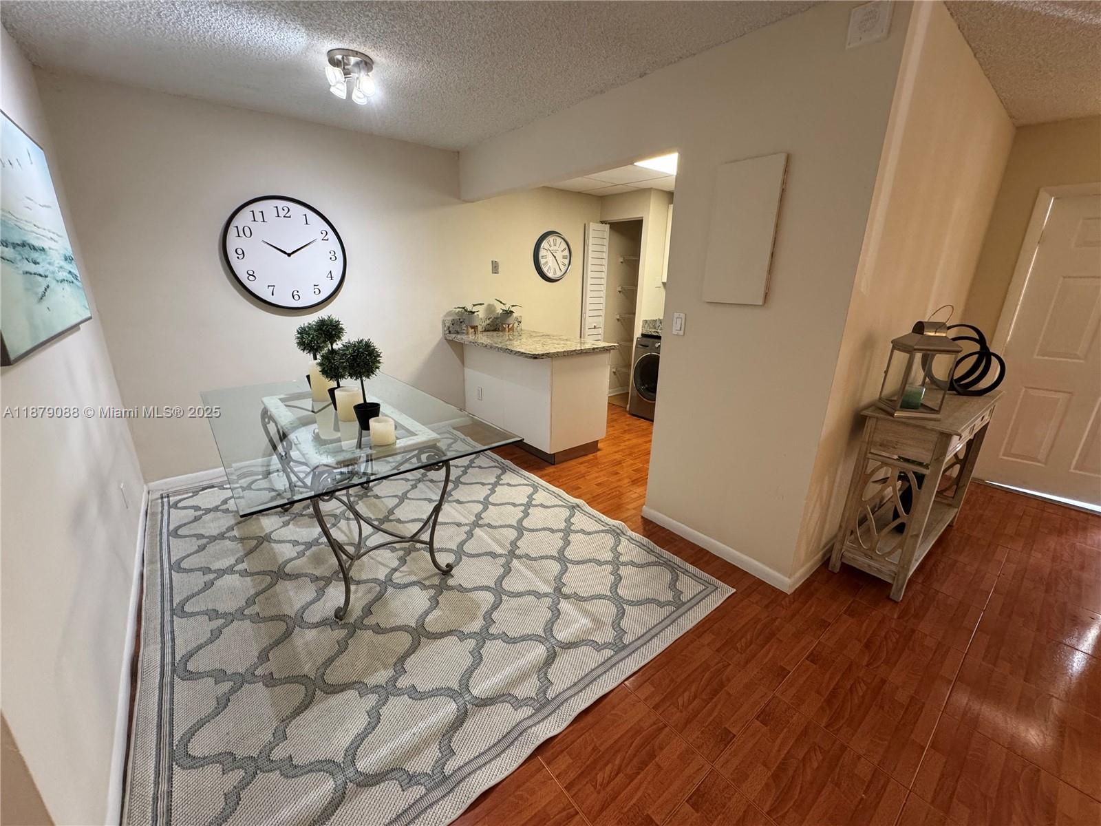 6900 Southwest 39th Street, Unit 206J Davie, FL 33314 - Photo 4 of 28 a view of a hallway with wooden floor