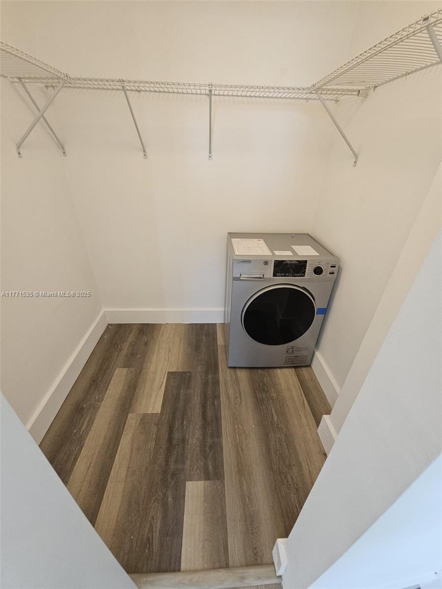 8101 Crespi Boulevard, Unit 304 Miami Beach, FL 33141 - Photo 16 of 25 a view of a room with racks on the wall