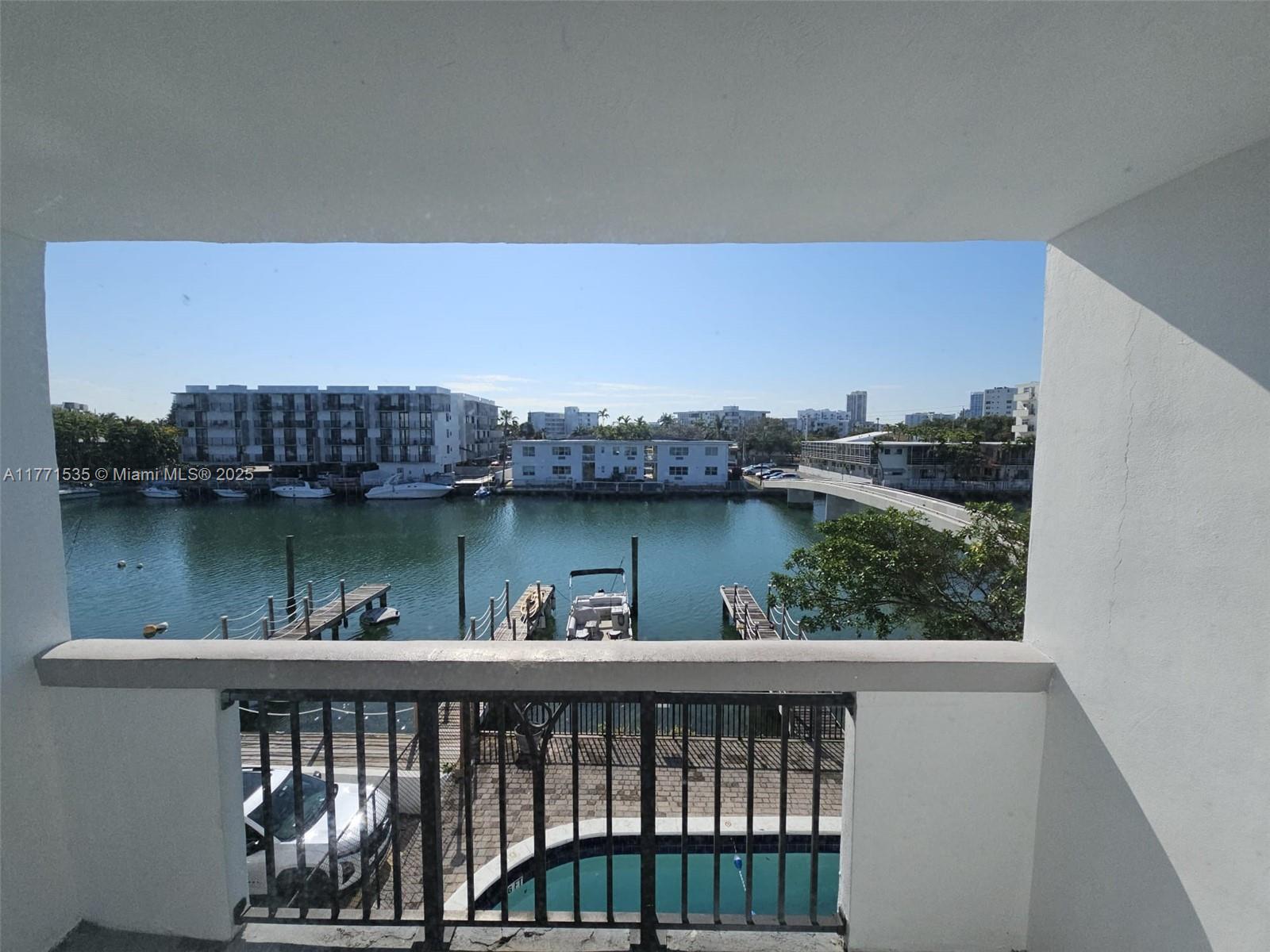 8101 Crespi Boulevard, Unit 304 Miami Beach, FL 33141 - Photo 7 of 25 a view of a roof deck with table and chairs