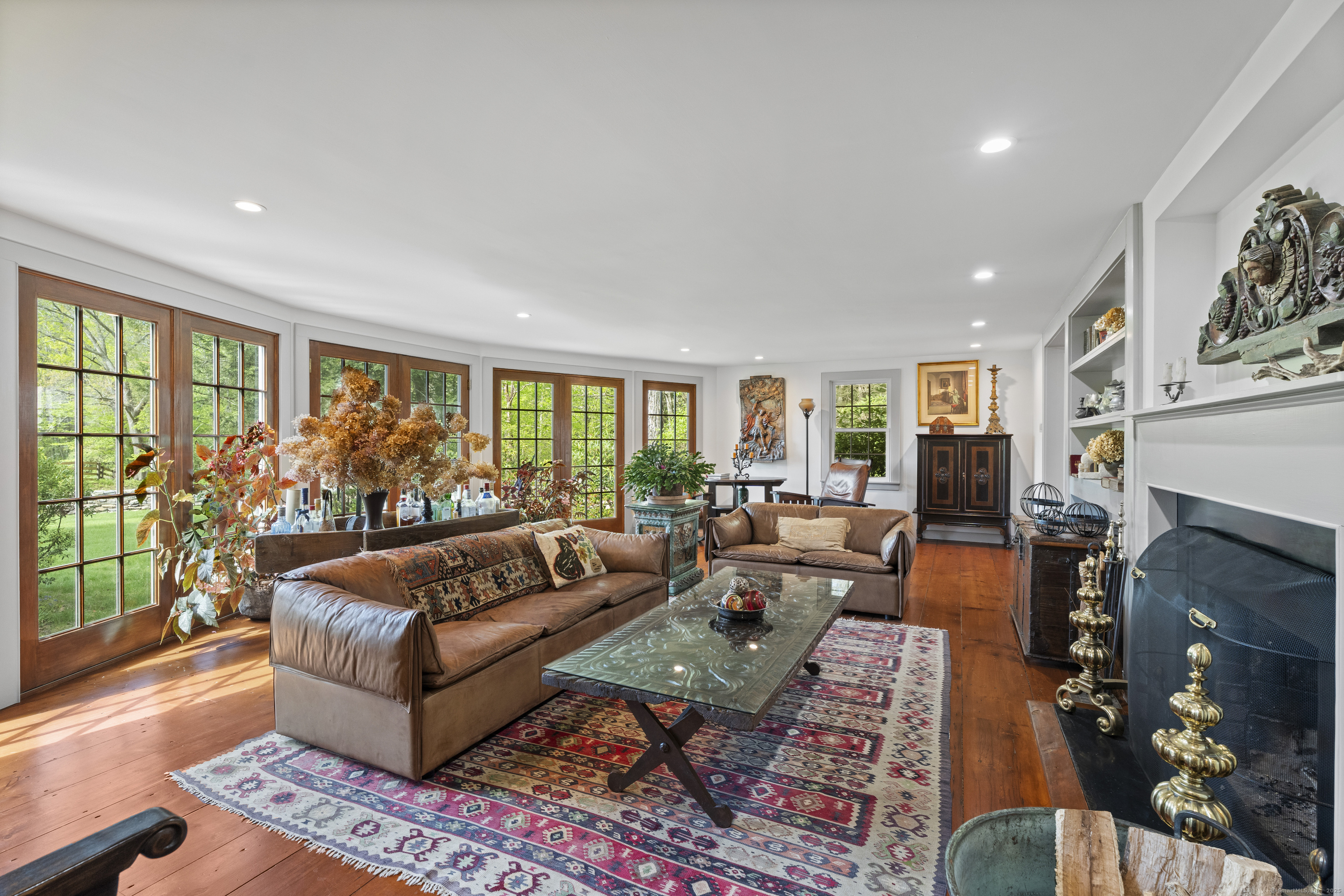 38 Three Bridges Road East Haddam, CT 06423 - Photo 11 of 39 a living room with furniture fireplace and a large window