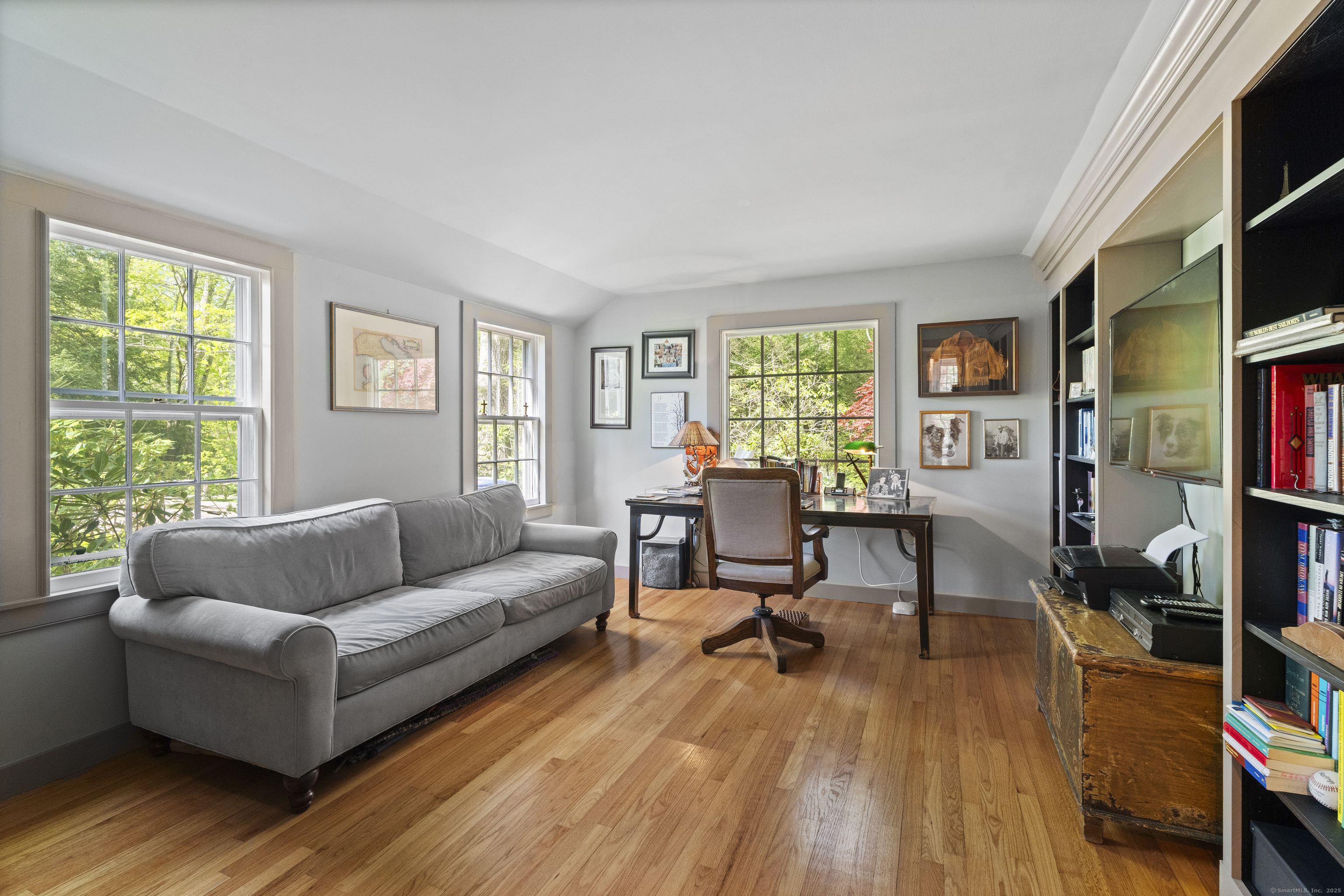 38 Three Bridges Road East Haddam, CT 06423 - Photo 12 of 39 a living room with furniture and a book shelf