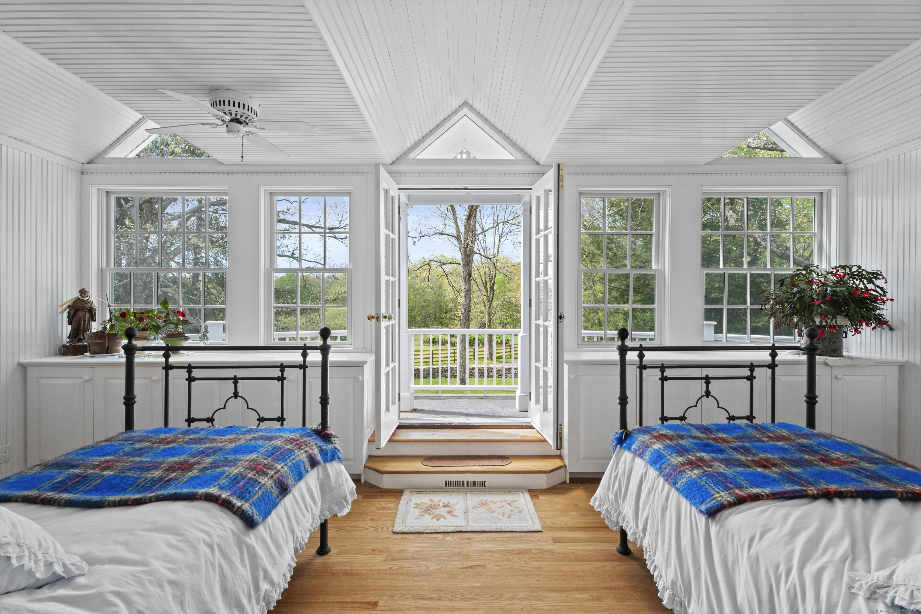 38 Three Bridges Road East Haddam, CT 06423 - Photo 19 of 39 a bedroom with a bed and a potted plant next to a window
