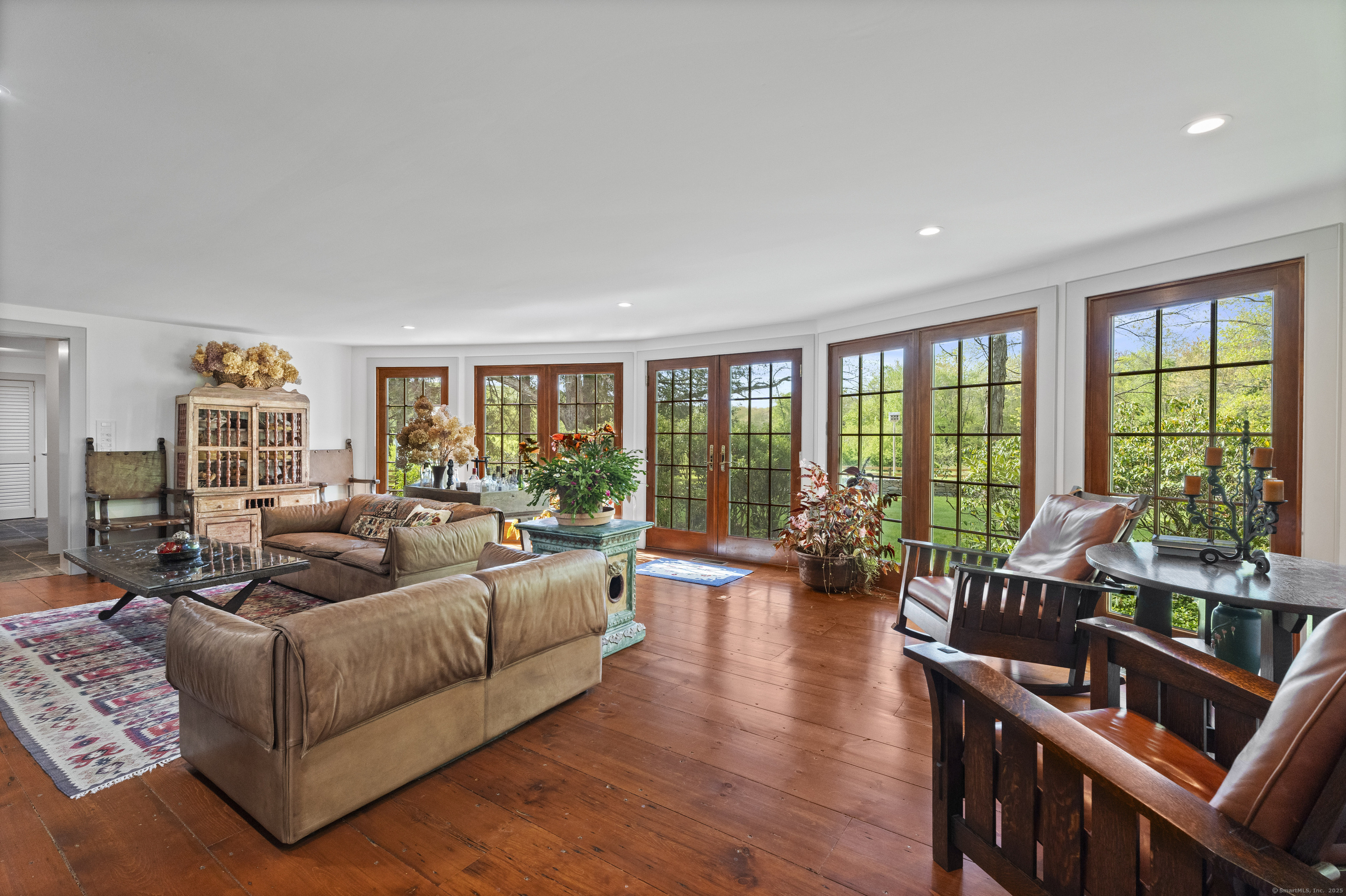 38 Three Bridges Road East Haddam, CT 06423 - Photo 10 of 39 a living room with furniture and floor to ceiling windows