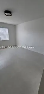 a view of a refrigerator in a bathroom