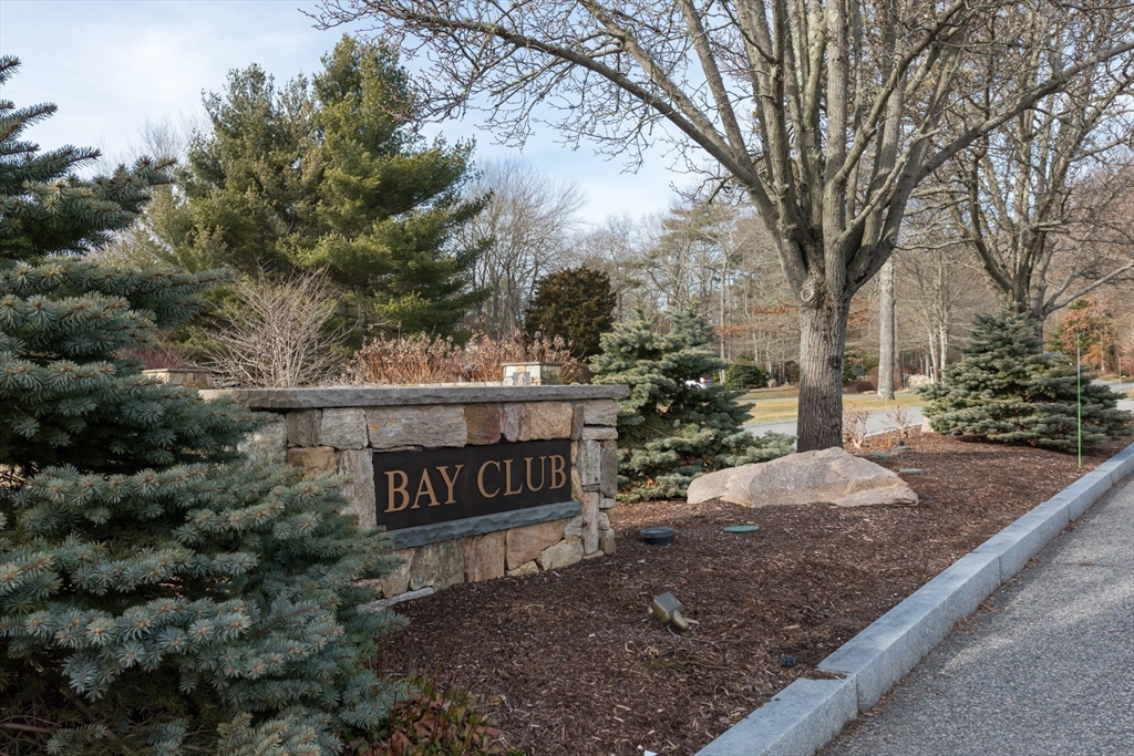 a view of a sign board and yard