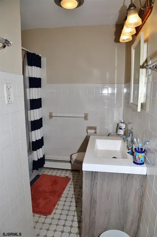 a bathroom with a bathtub and a sink