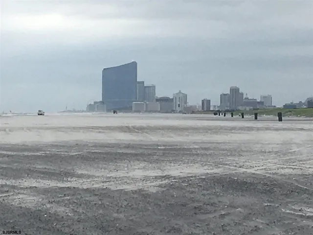 a room with a bed and a night stand