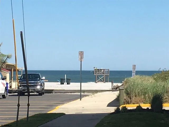 a swimming pool with outdoor seating and yard