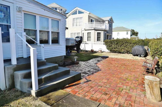a front view of a house with wooden stairs