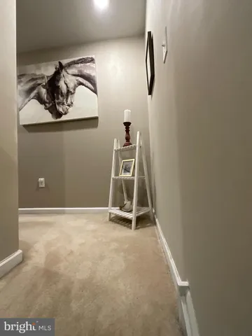 a living room with lots of wooden furniture