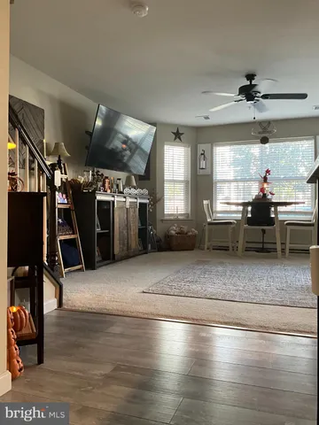 a view of a hall with wooden floor