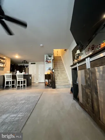 a view of a livingroom with furniture and a fireplace