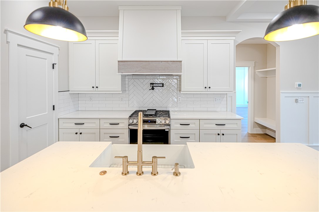 1409 Stonehurst Road Anderson, SC 29621 - Photo 13 of 36 This bright kitchen features sleek appliances and ample counter space, perfect for culinary endeavors.