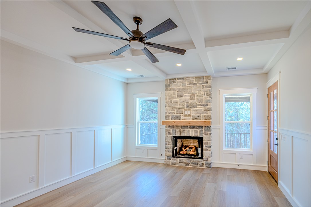 1409 Stonehurst Road Anderson, SC 29621 - Photo 19 of 36 This inviting living space features a stone fireplace, perfect for cozy gatherings and creating lasting memories.