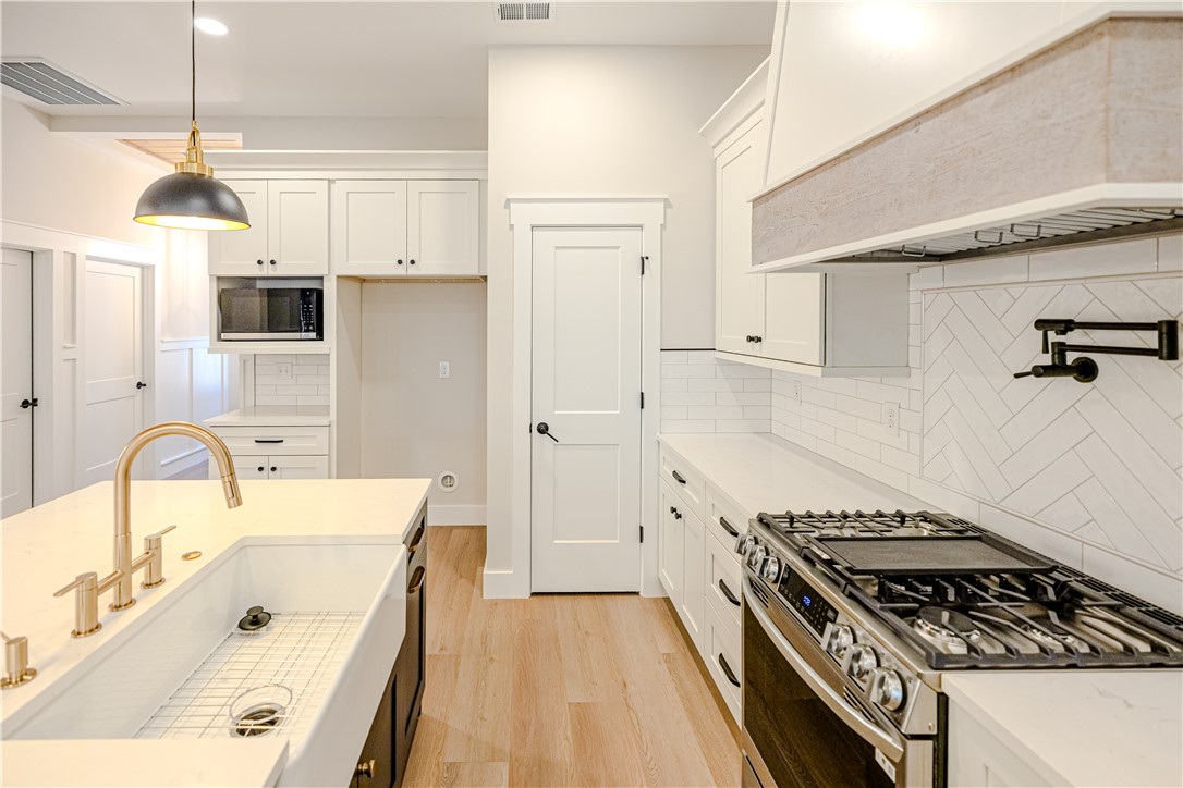1409 Stonehurst Road Anderson, SC 29621 - Photo 27 of 36 This bright kitchen features modern appliances and a spacious island, perfect for culinary adventures.