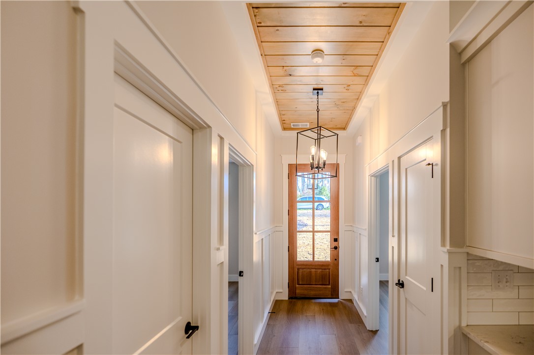 1409 Stonehurst Road Anderson, SC 29621 - Photo 3 of 36 This entry hall features a warm wood ceiling and inviting front door.