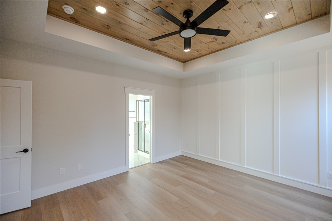 1409 Stonehurst Road Anderson, SC 29621 - Photo 33 of 36 This spacious bedroom features a distinctive wood-paneled ceiling and light-toned flooring.