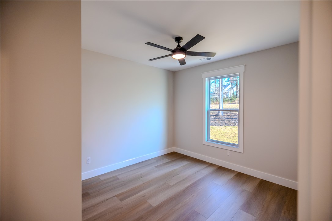 1409 Stonehurst Road Anderson, SC 29621 - Photo 35 of 36 This airy room features durable flooring and a bright window, creating a serene and adaptable space.
