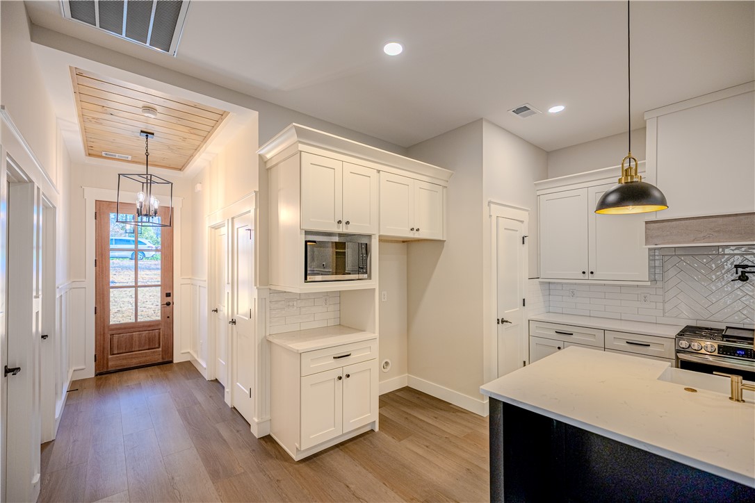1409 Stonehurst Road Anderson, SC 29621 - Photo 4 of 36 This bright and open space offers a welcoming entry and a thoughtfully designed kitchen.