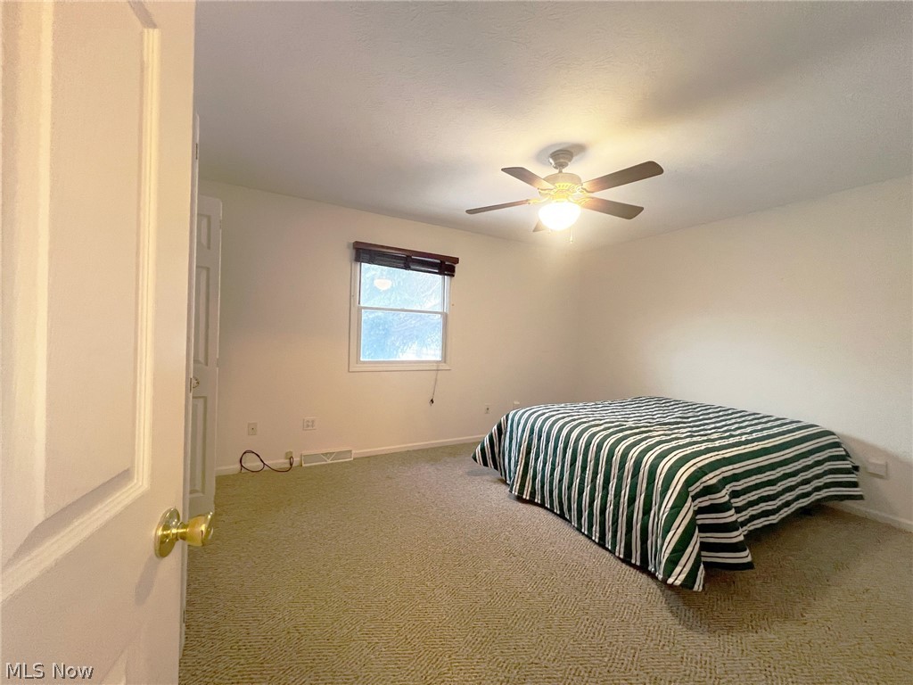 5203 Ridgeland Street Lorain, OH 44055 - Photo 7 of 39 Bedroom featuring carpet flooring and ceiling fan