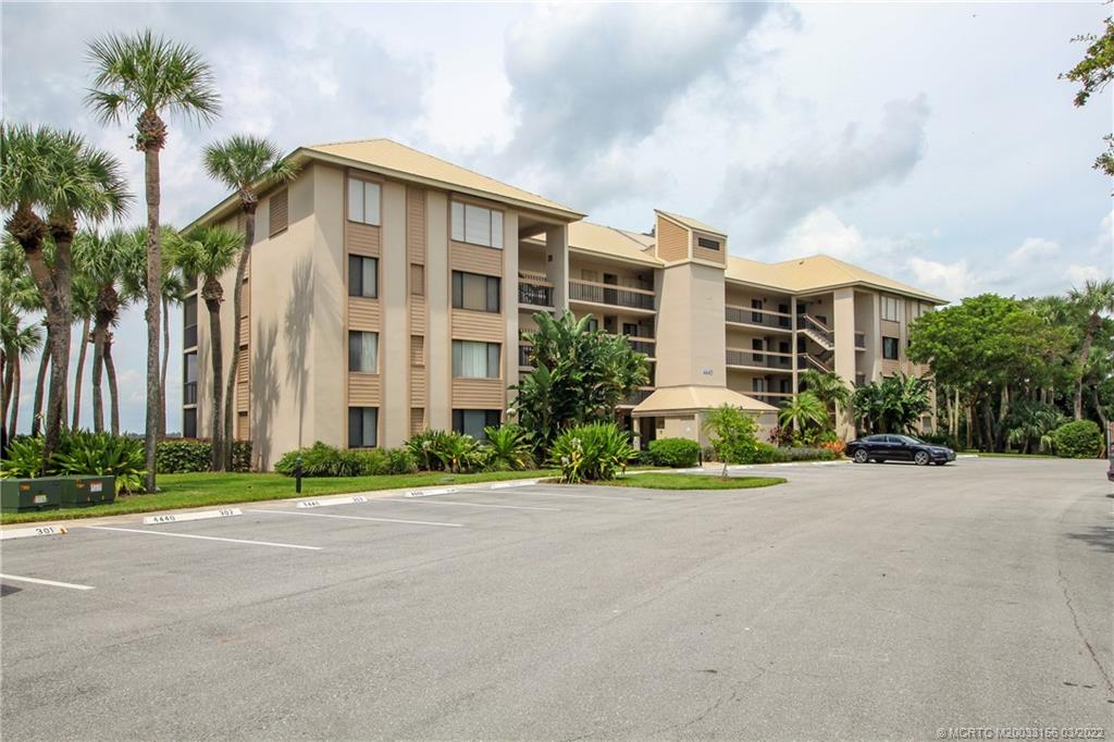4440 Northeast Sandpebble Trace, Unit 403 Jensen Beach, FL 34957 - Photo 2 of 31 a view of a building with a street