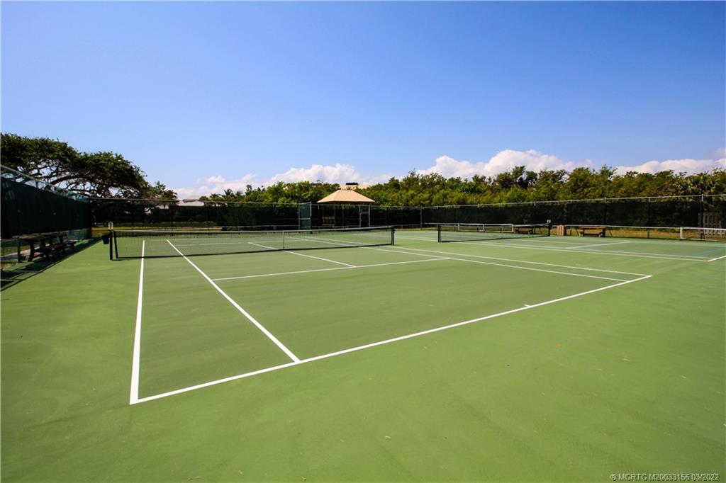 4440 Northeast Sandpebble Trace, Unit 403 Jensen Beach, FL 34957 - Photo 26 of 31 a view of tennis court with seating area