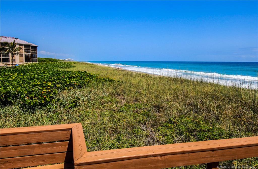 4440 Northeast Sandpebble Trace, Unit 403 Jensen Beach, FL 34957 - Photo 28 of 31 a view of an outdoor space and deck