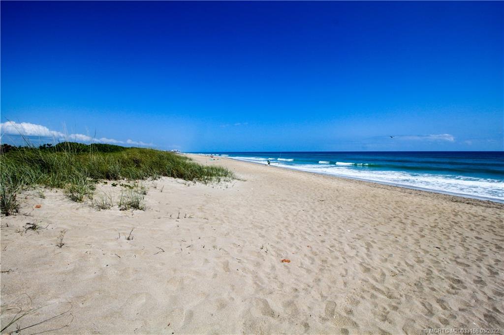 4440 Northeast Sandpebble Trace, Unit 403 Jensen Beach, FL 34957 - Photo 30 of 31 a view of beach and ocean