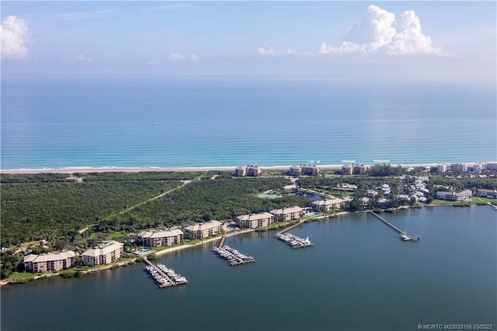 4440 Northeast Sandpebble Trace, Unit 403 Jensen Beach, FL 34957 - Photo 31 of 31 an aerial view of residential building with outdoor space