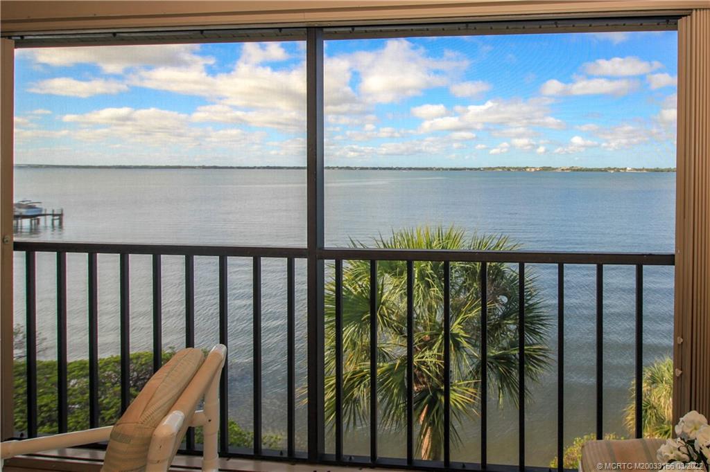 4440 Northeast Sandpebble Trace, Unit 403 Jensen Beach, FL 34957 - Photo 6 of 31 a view of a balcony with wooden floor and outdoor space