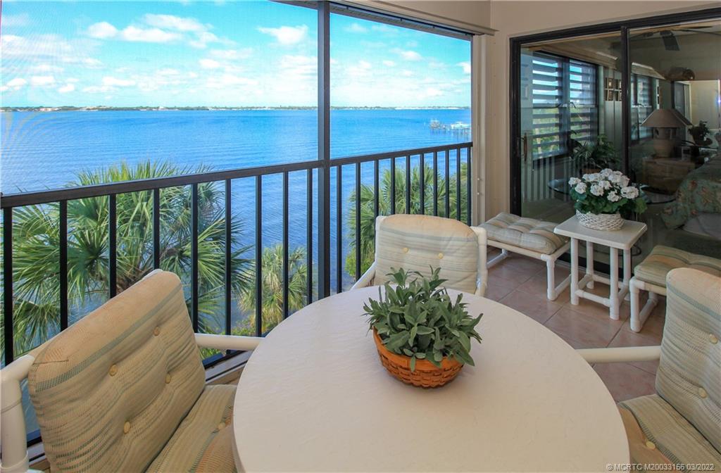 4440 Northeast Sandpebble Trace, Unit 403 Jensen Beach, FL 34957 - Photo 7 of 31 a view of a porch with furniture