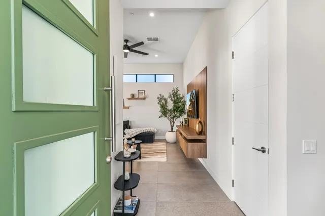 a view of a hallway with seating area