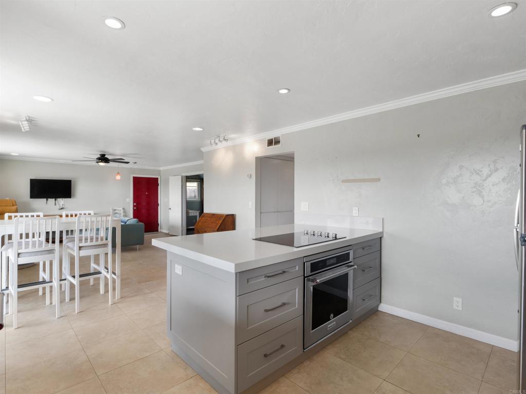 852 Dewitt Avenue Encinitas, CA 92024 - Photo 17 of 41 a kitchen with a sink and a stove top oven