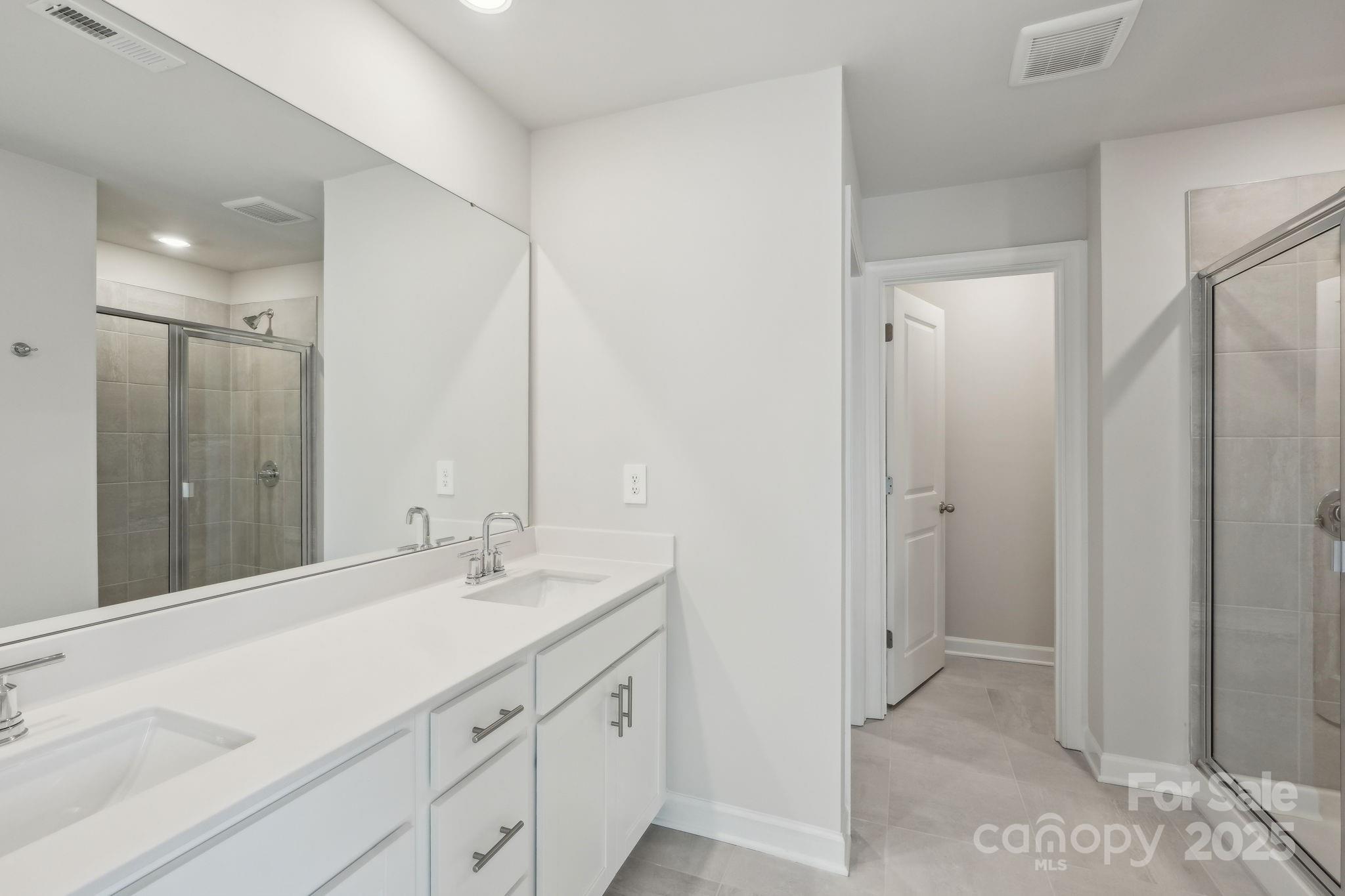 1321 30th St Lane Northeast Conover, NC 28613 - Photo 17 of 27 a bathroom with a sink and a mirror