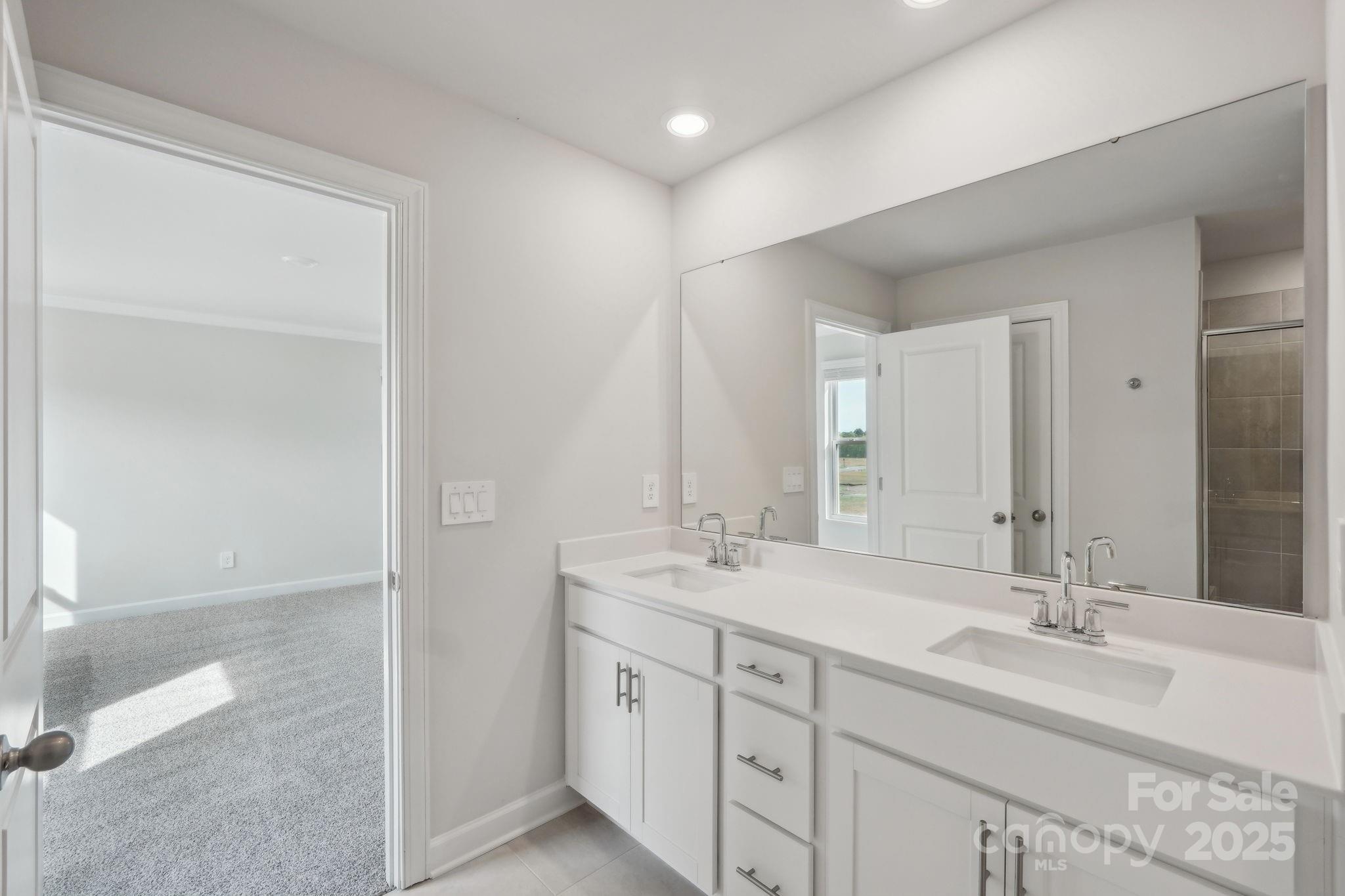 1321 30th St Lane Northeast Conover, NC 28613 - Photo 19 of 27 a bathroom with double sink and a mirror
