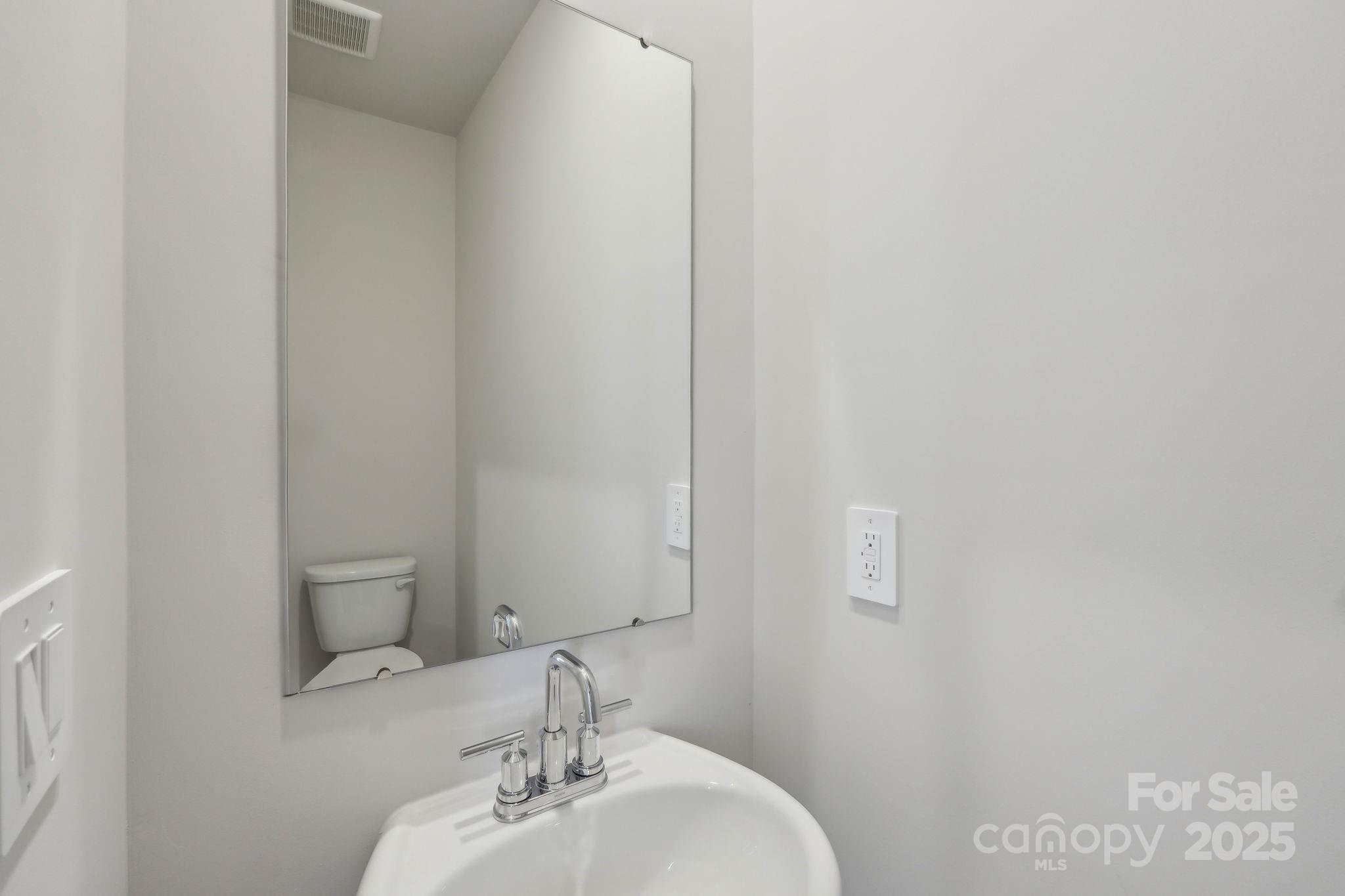 1321 30th St Lane Northeast Conover, NC 28613 - Photo 27 of 27 a bathroom with a sink and a mirror