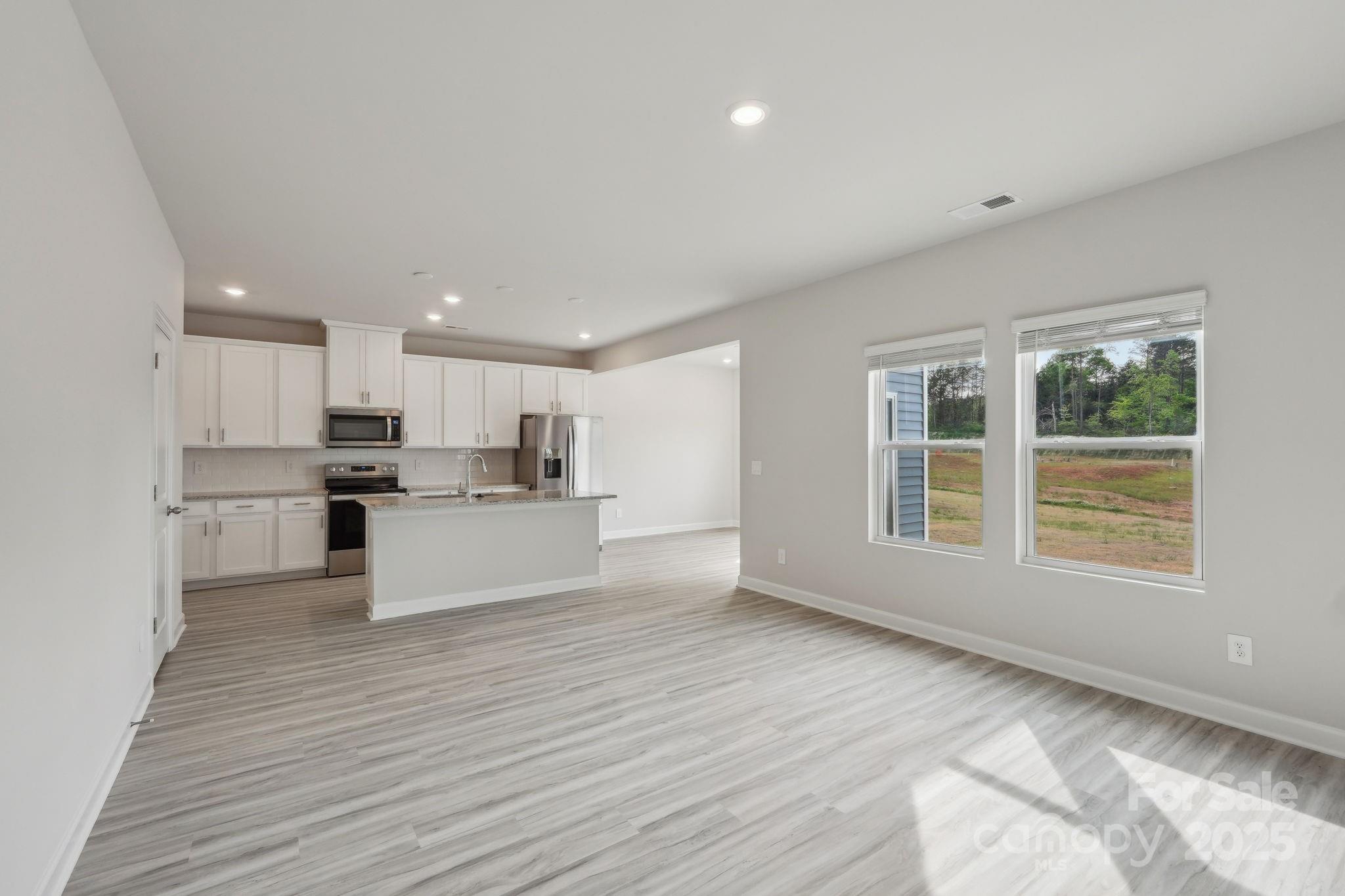 1321 30th St Lane Northeast Conover, NC 28613 - Photo 4 of 27 a view of kitchen with wooden floor and electronic appliances