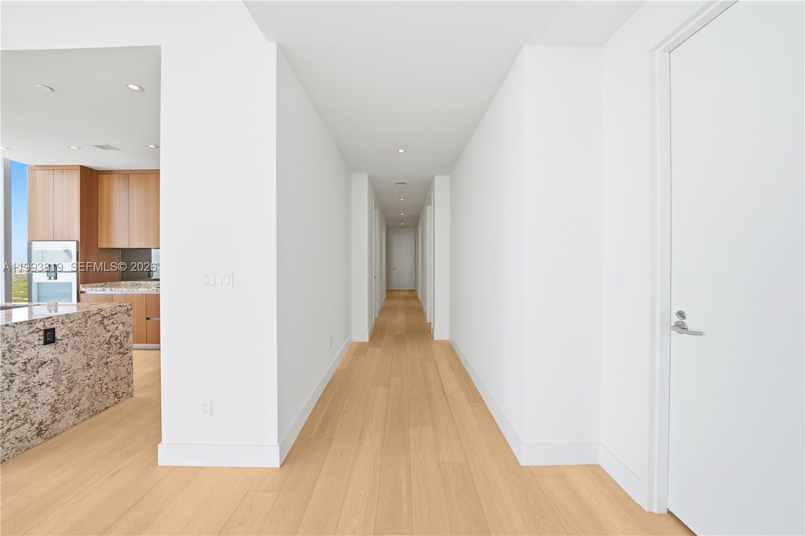 175 Southeast 25th Road, Unit 3102 Miami, FL 33129 - Photo 11 of 65 a view of a hallway with wooden floor