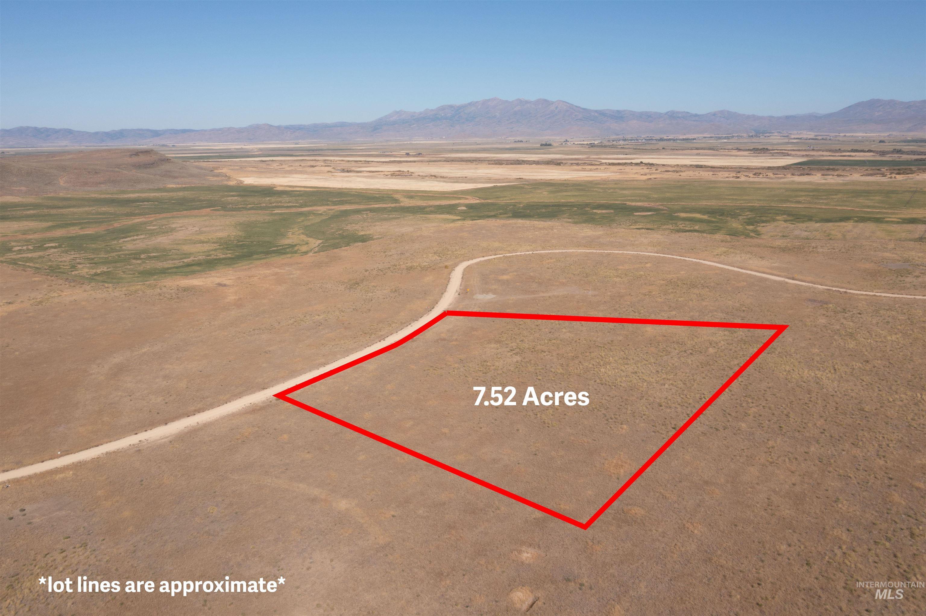 3 Redtail Lane Fairfield, ID 83327 - Photo 2 of 8 Aerial view of sparsely populated area featuring property parcel outlined and a mountain backdrop